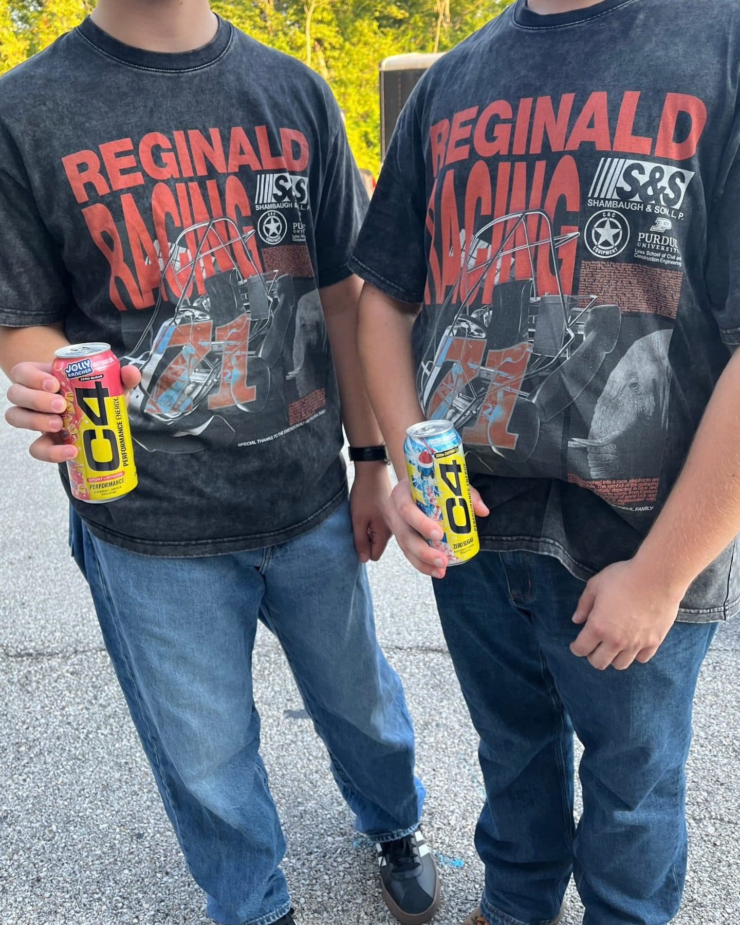 Two racing team shirts and two C4 Energy cans